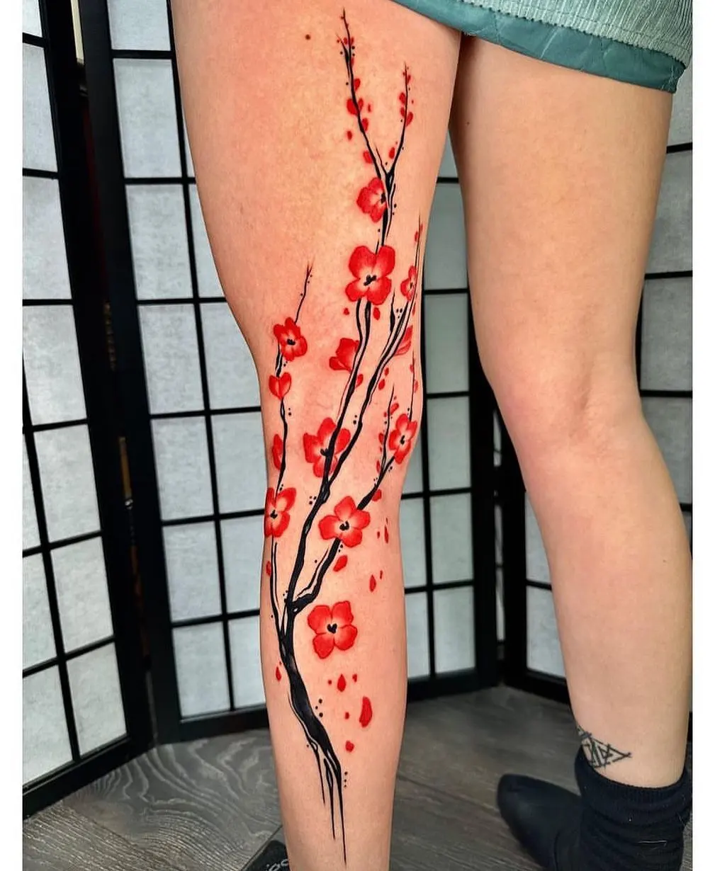 Leg cherry blossom tree tattoo